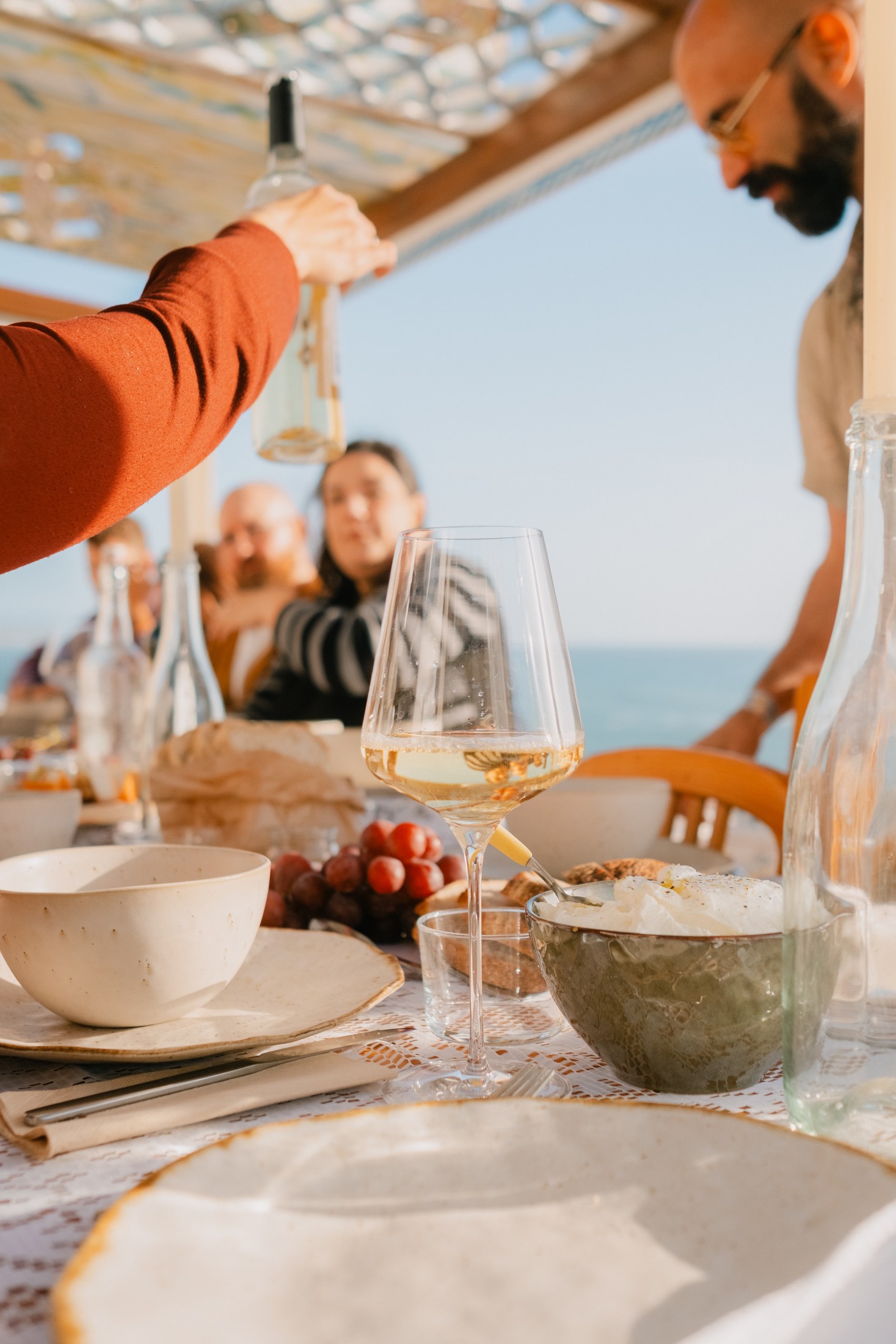 Wine being poured during dinner in Ericeira